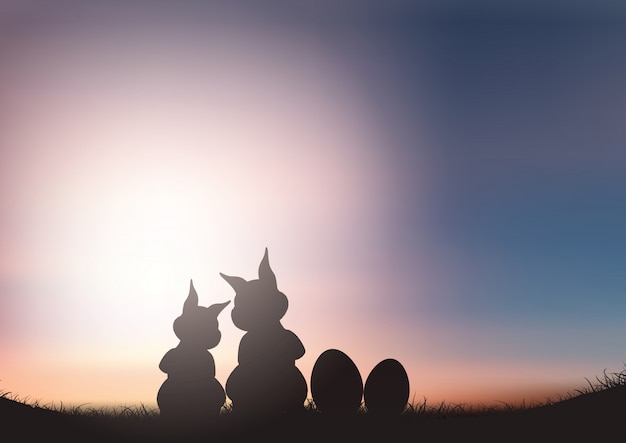 Free vector silhouette of easter bunnies against a sunset sky