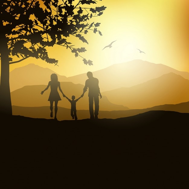 Silhouette of a family walking in the countryside