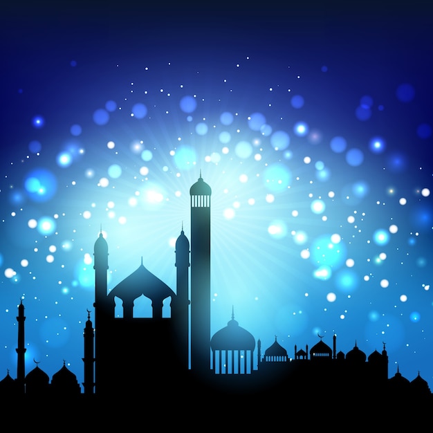 Silhouette of mosques against a bokeh night sky