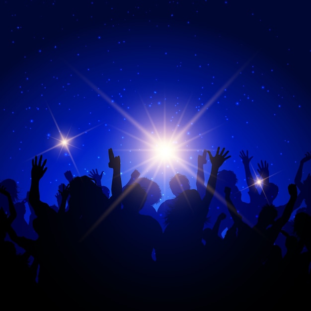 Silhouette of a party crowd on a night sky background