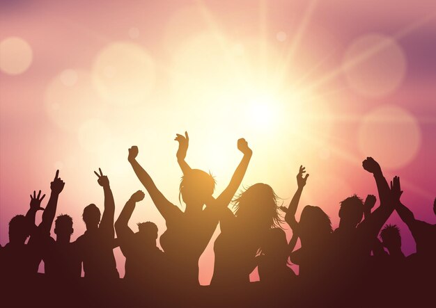 Silhouette of a party crowd on a sunset background