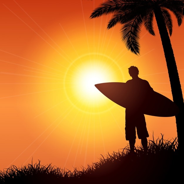 Silhouette of a surfer against a tropical background