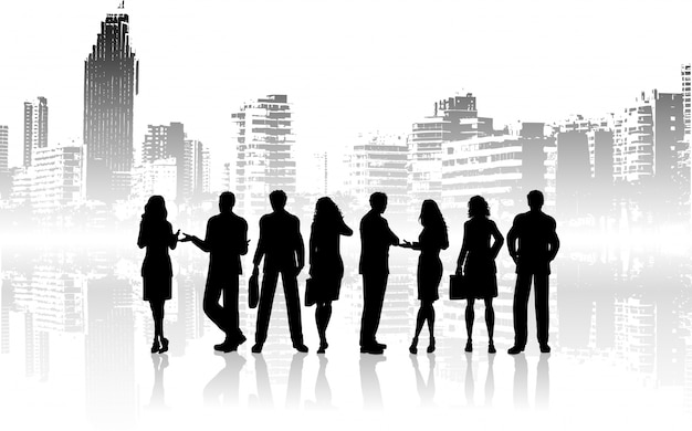 Silhouettes of business people against grunge city background