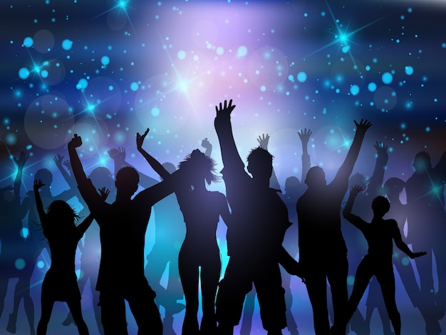 Silhouettes of people dancing on an abstract lights background