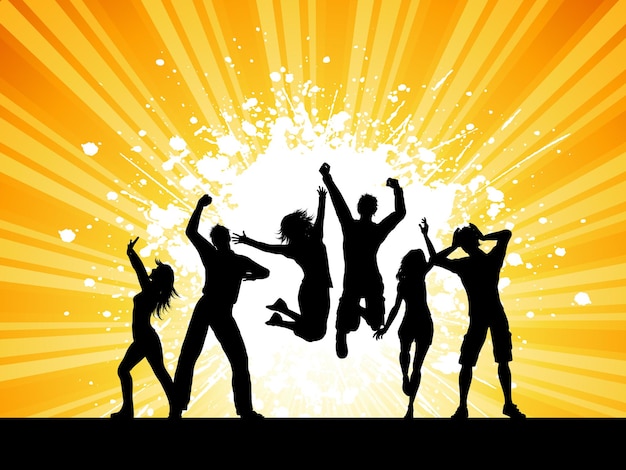 Silhouettes of people dancing on a grunge starburst background