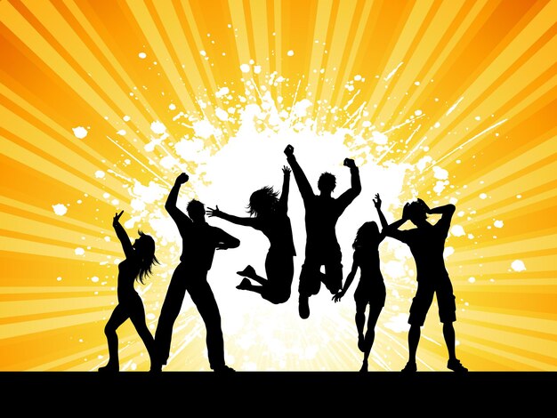 Silhouettes of people dancing on a grunge starburst background