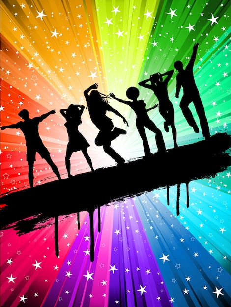 Silhouettes of people dancing on a starry multi coloured background