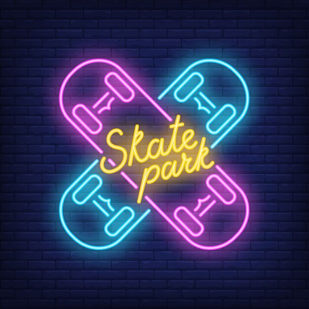 Skate park neon text on crossed skateboards. Neon sign, night bright advertisement