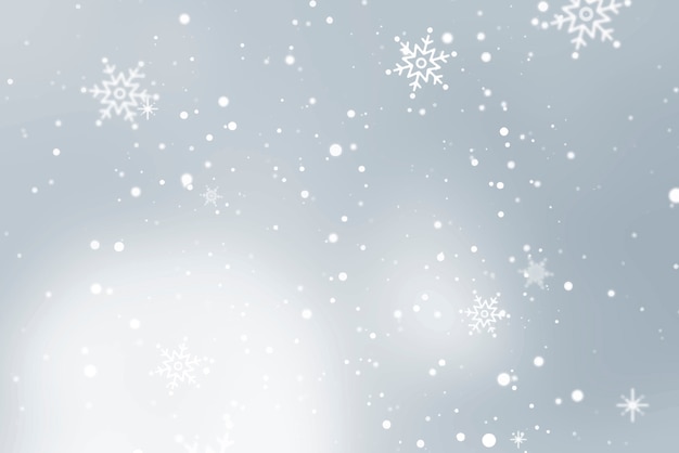 Snowflakes falling over gray background