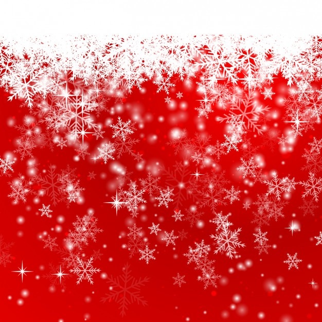赤いクリスマスの背景に雪片
