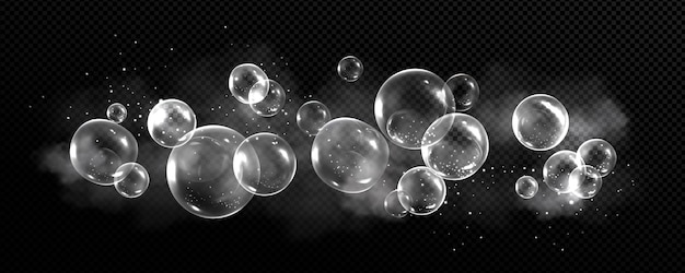 Soap bubbles with smoke and particles on black