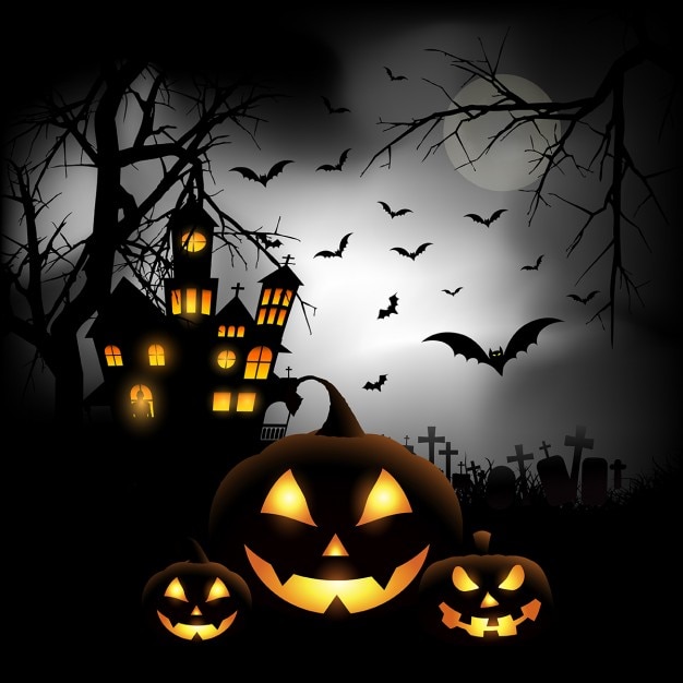 Spooky halloween background with pumpkins in a cemetery