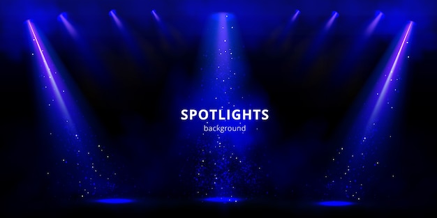 Фон прожекторов, синие сценические световые лучи с дымом и блестками на черном фоне.