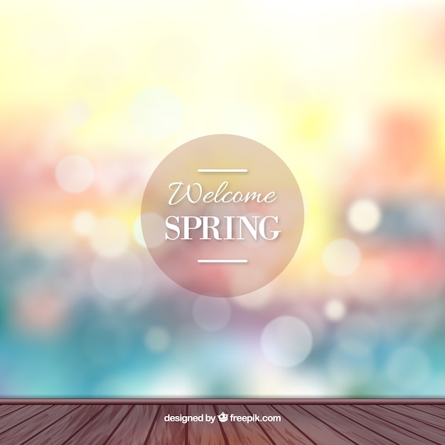 Free vector spring bokeh background in blue, red and yellow tones