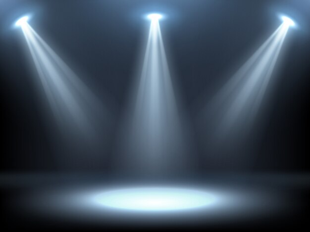 stage illuminated by spotlights