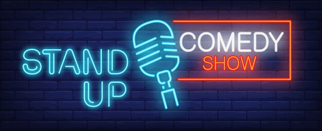Stand up Comedy show neon sign. Blue microphone on brick wall. 