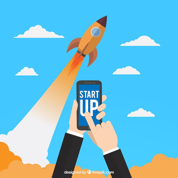 Vettore gratuito start up concept con razzo e smartphone