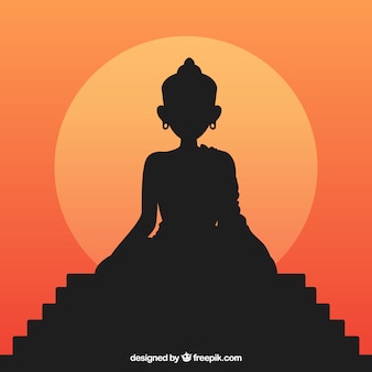 Statue of buddha silhouette with sunset