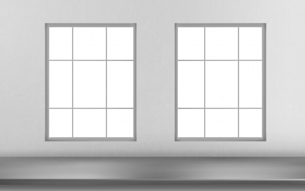 Стальная поверхность стола перед окнами на белой стене
