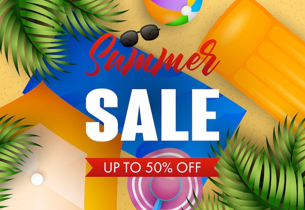 Summer sale lettering with beach mat, hat, ball and air mattress