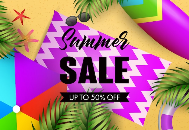 Summer sale lettering with beach mat and tropical leaves