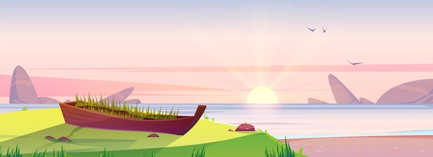 Sunrise beach and old wooden boat with green grass