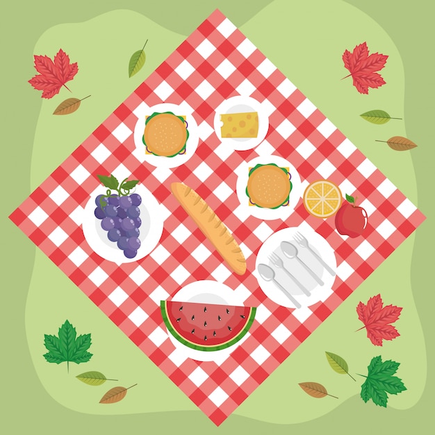 Tablecloth with hamburgers and grapes with watermelon and cheese