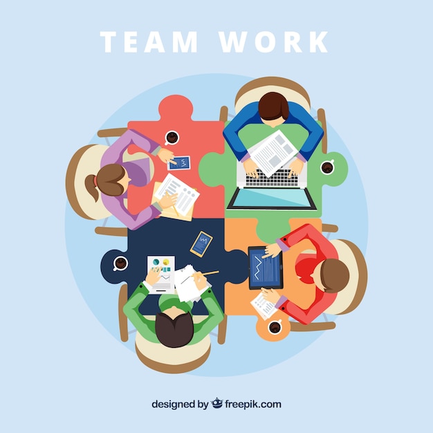 Teamwork concept with jigsaw desk