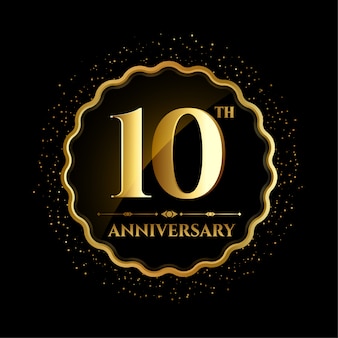 Ten anniversary in golden frame with sparks Free Vector