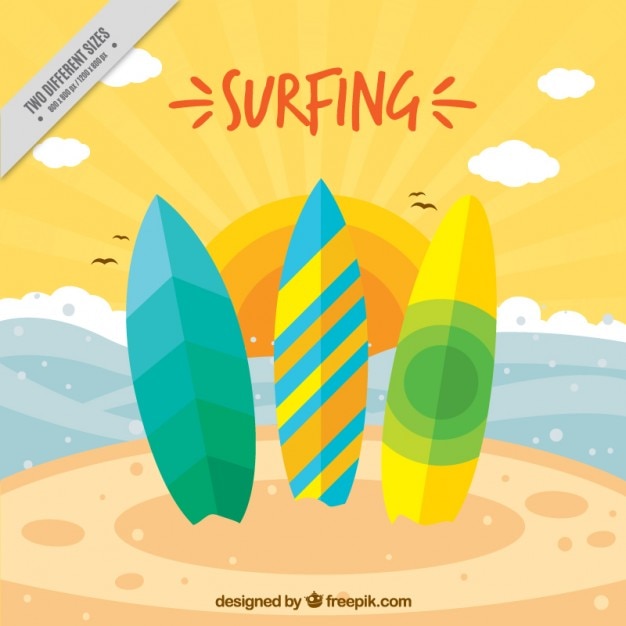 Free vector three colored surfboards on the beach background