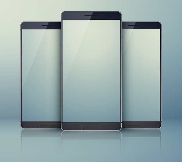 Collezione di smartphone in tre pezzi sul grigio con cellulari moderni e identici e con ombre sui loro touchscreen digitali chiari.