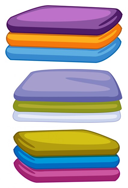 Three stacks of towels in different color