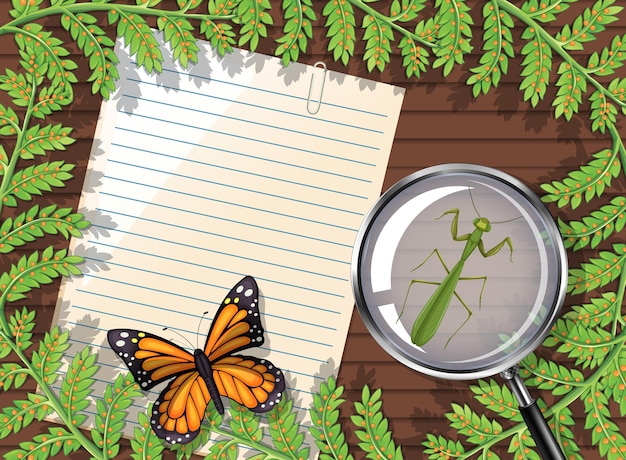 Top view of blank paper on table with leaves and insects elements