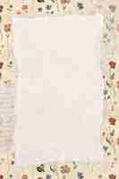 Free vector torn paper on a floral background