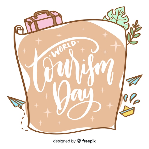 Free vector tourism day concept with lettering