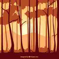 Free vector trunks of tree silhouettes background in orange tone