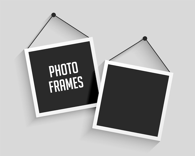 Free vector two blank hanging photo frames background