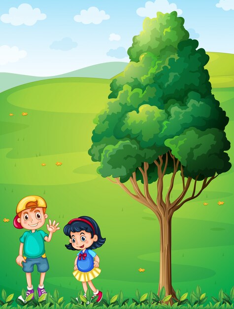 木の近くの丘の上で2人の子供