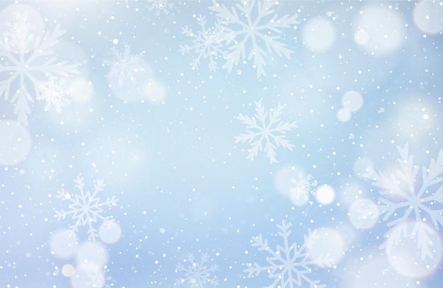 Free vector unfocussed winter background with snowflakes