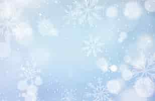 Free vector unfocussed winter background with snowflakes