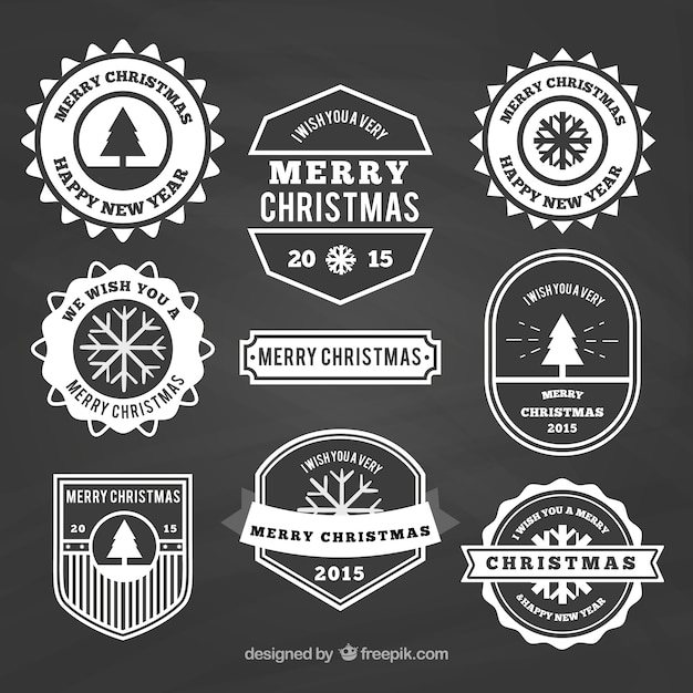 Free vector variety of christmas insignias on blackboard