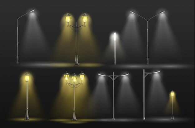 Various city street lights glowing in darkness yellow warm and cold white light