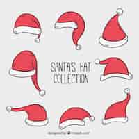 Free vector various hand-drawn santa claus decorative hats