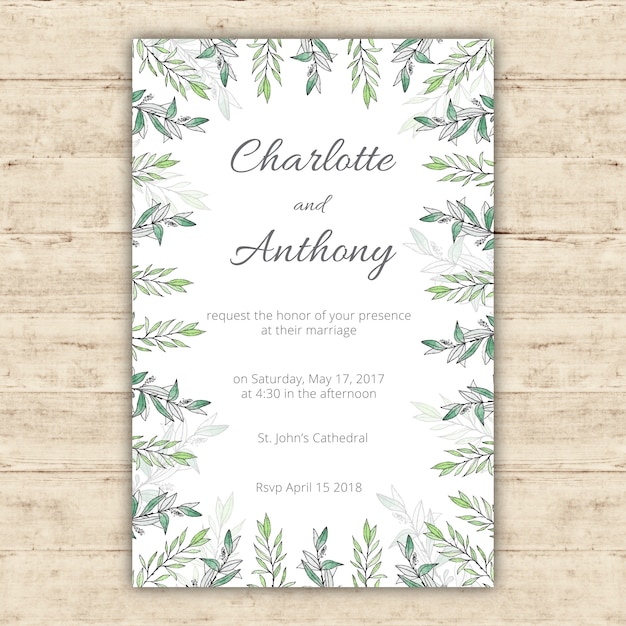 Free vector watercolor wedding invitation template with green leaves