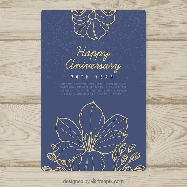 Free vector wedding anniversary card with flowers in hand drawn style