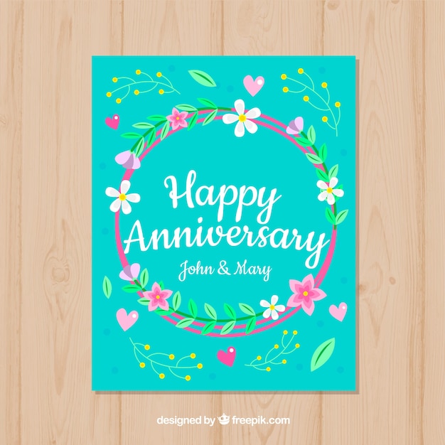 Free vector wedding anniversary card with wreath of flowers