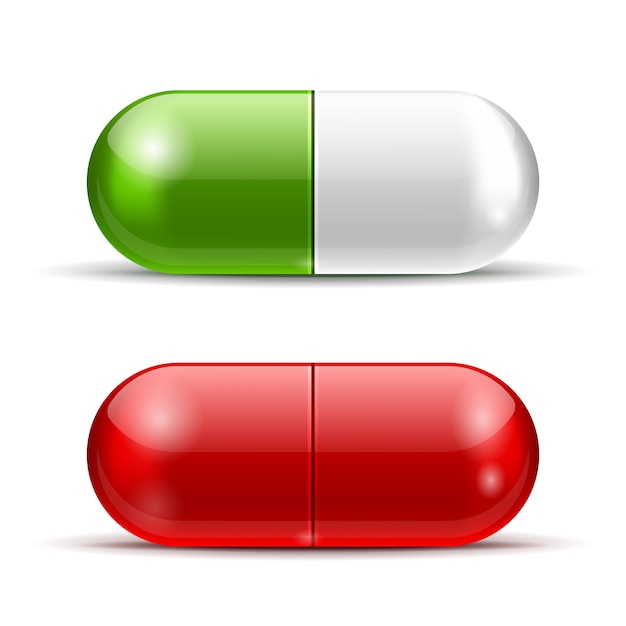 Белые, зеленые и красные таблетки изолированы