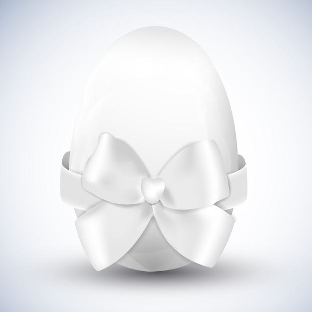 Free vector white happy easter egg with big ribbon bow isolated realistic vector illustration