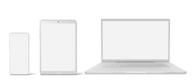 白いノートパソコン、タブレット、空白の画面を持つ電話