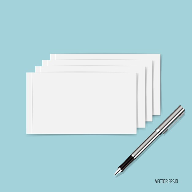 White papers and pen on blue background